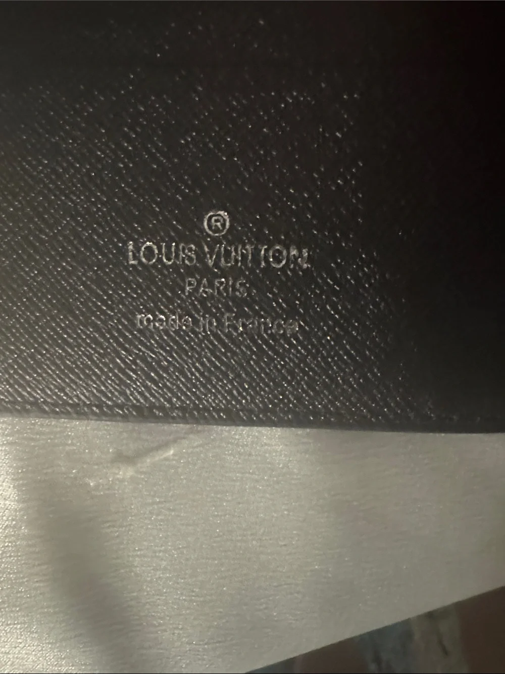 Louis Vuitton x Supreme Epi leather wallet featuring an embossed Supreme logo!